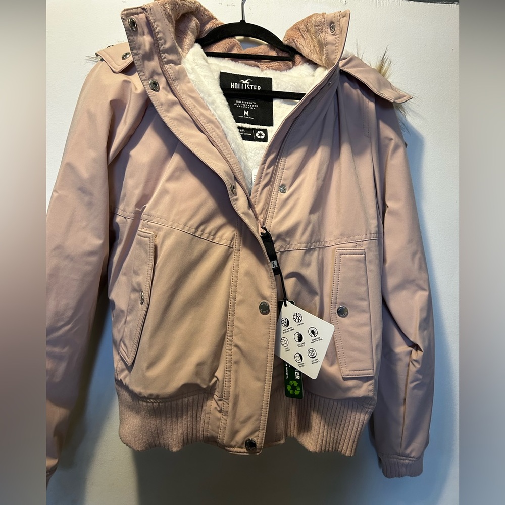 Light pink Bomber jacket with faux fur lining.